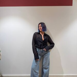 Denim vita media bassa elasticizzato con gamba ampia e svasata